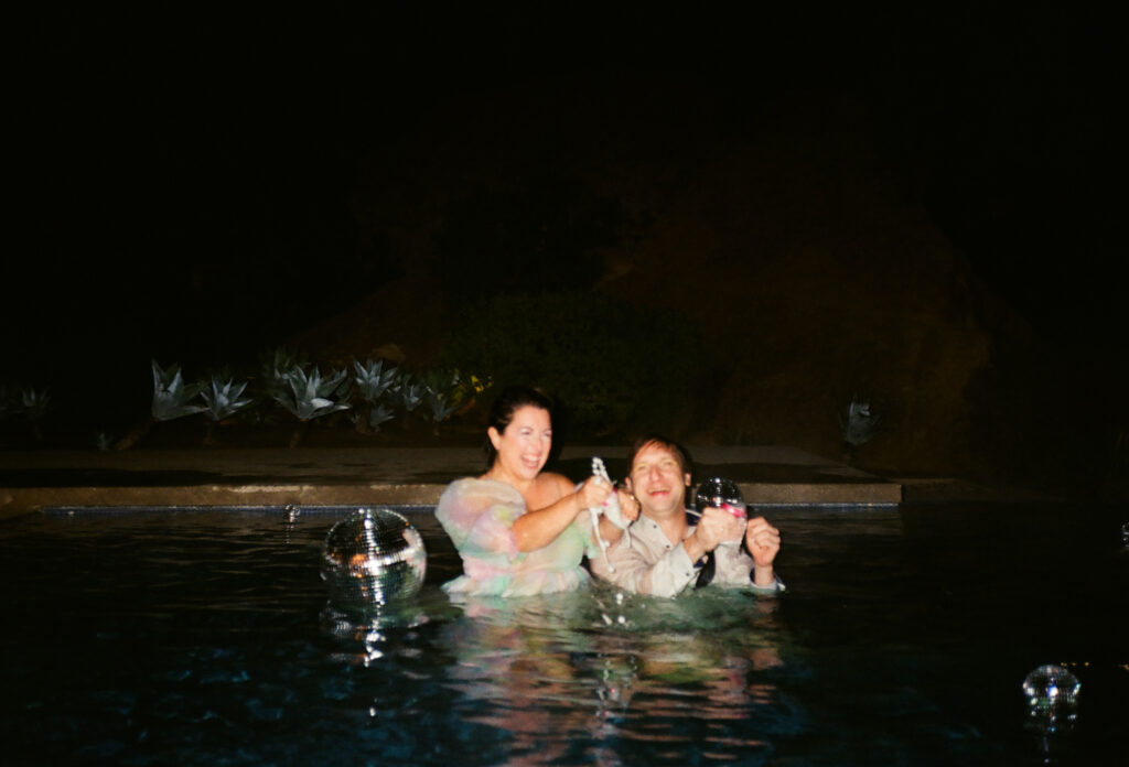 Couple jumping into pool on their wedding night in Topanga Canyon.