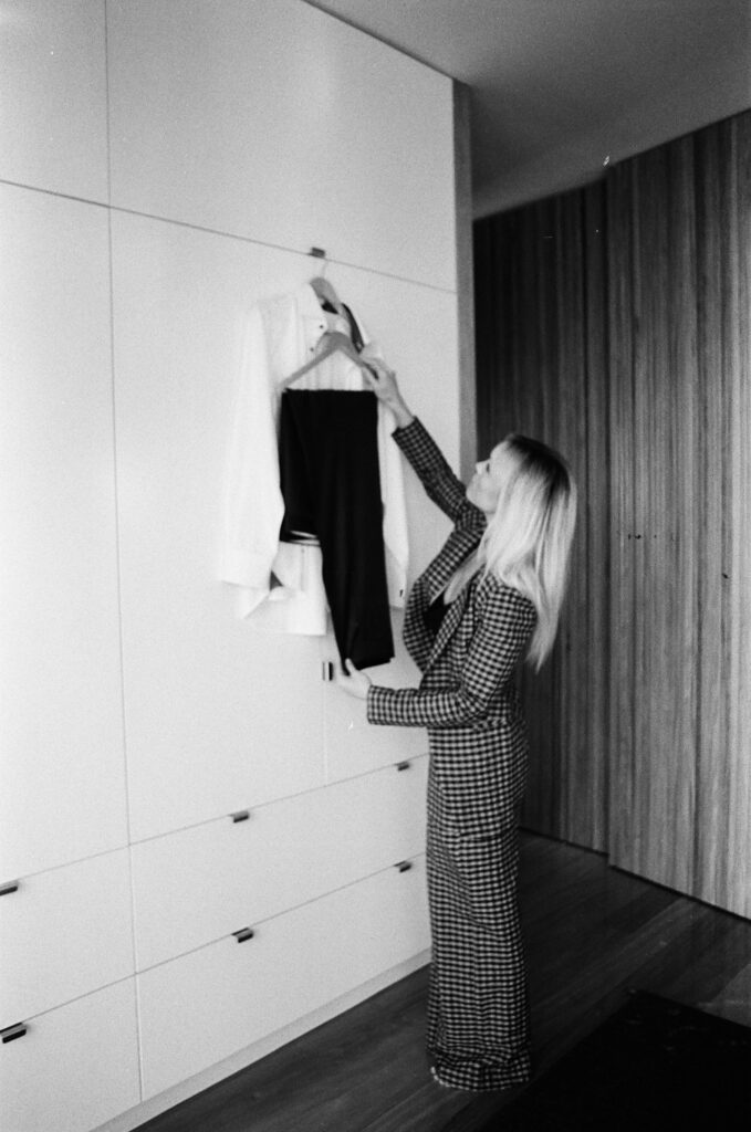 Photographer prepping Groom's suit. Topanga Canyon Malibu Destination Wedding