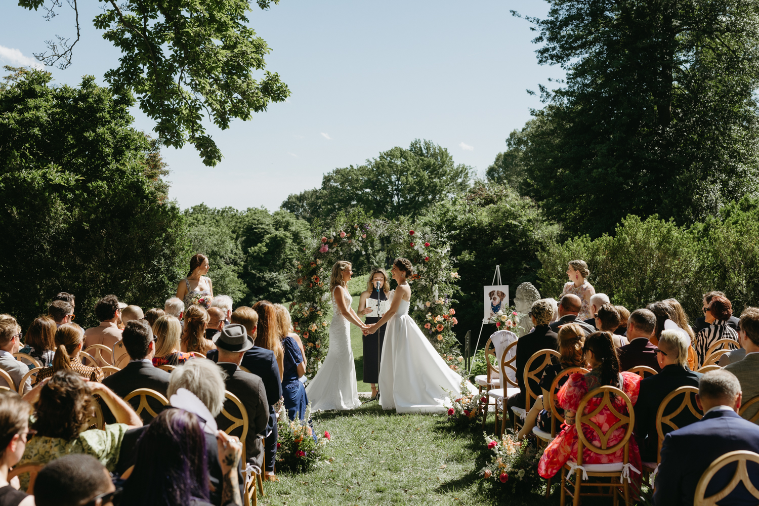 Two brides getting married in the gardens at the Virginia House wedding venue in Richmond, Virginia
