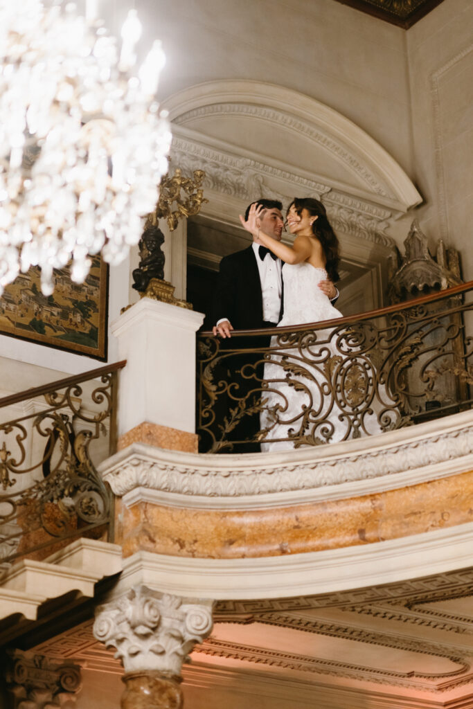 Bride and groom waving at guests before entering their reception at Larz Anderson House DC Wedding