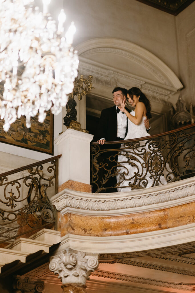 Bride and groom waving at guests before entering their reception at Larz Anderson House DC Wedding