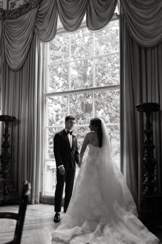 Couple sharing a quiet moment in the library room at the Larz Anderson House

