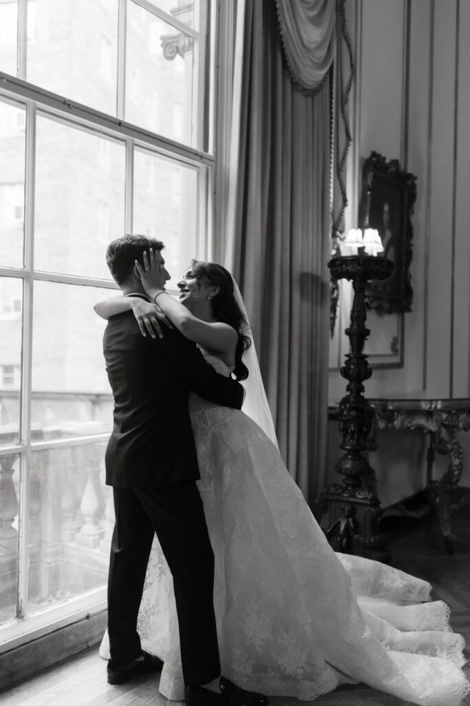 Couple sharing a quiet moment in the library room at the Larz Anderson House
