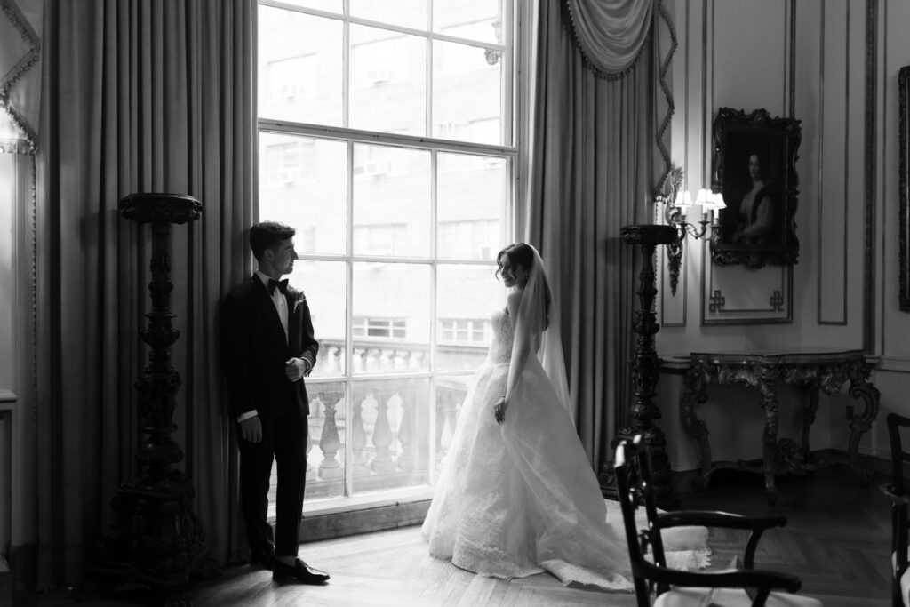Couple sharing a quiet moment in the library room at the Larz Anderson House
