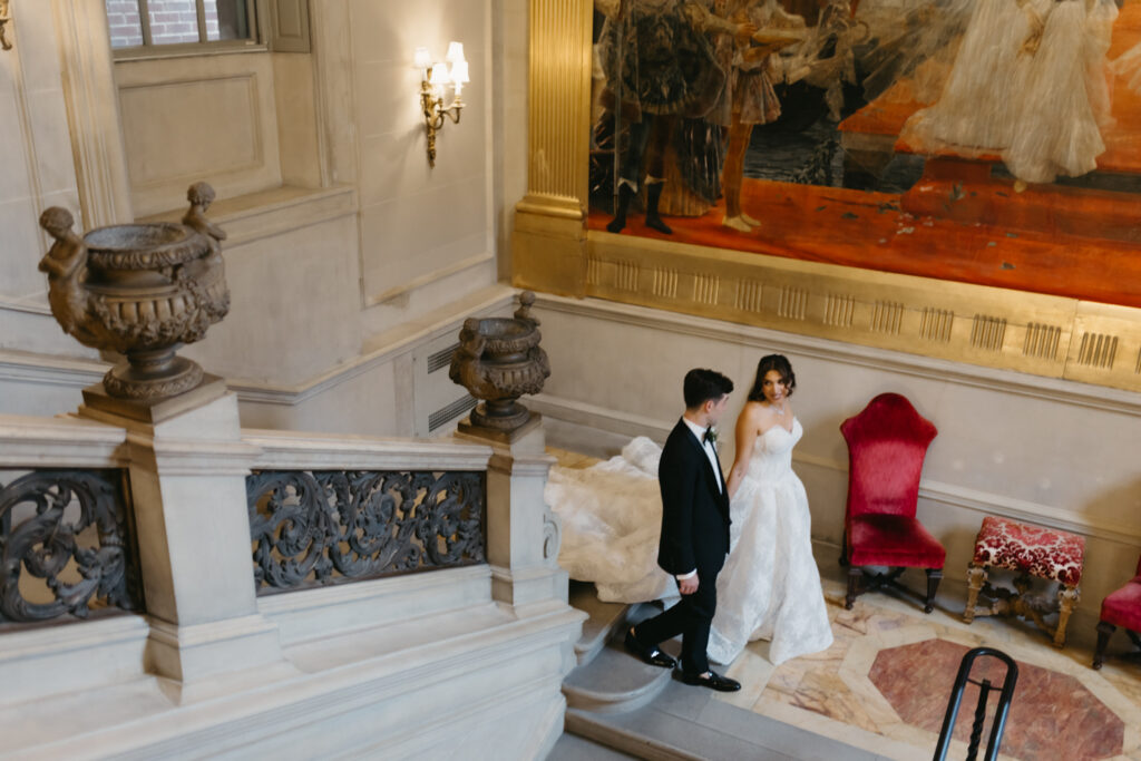 Fine art Portrait of bride and groom walking up the marble staircase at Larz Anderson House in Washington DC