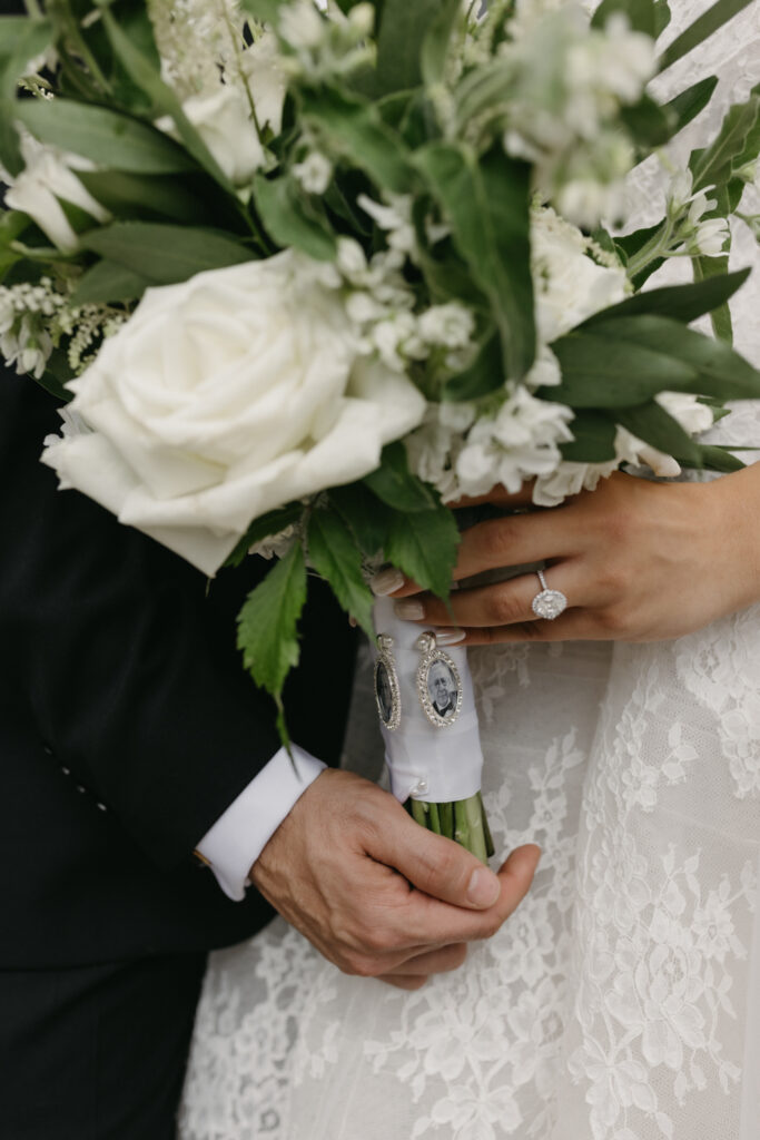 Fine art detail shot of bride's bouquet being held by bride and groom at the Larz Anderson House