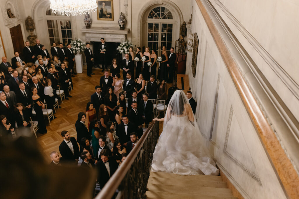 Bride entering the ceremony through the staircase in the Larz Anderson House in DC