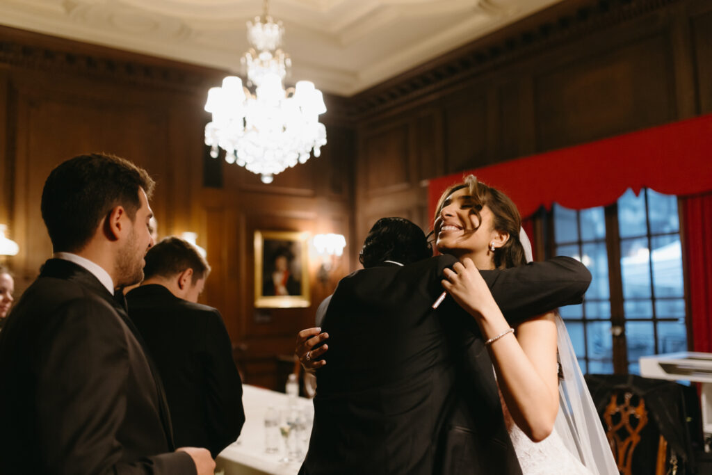 Bride and Groom hugging their guests at their formal Larz Anderson House DC Wedding