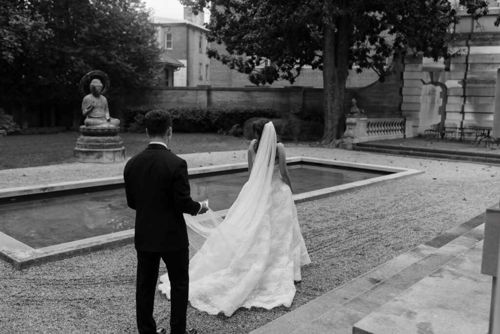 Evening portrait of the newlyweds outside the Larz Anderson House illuminated by soft lighting