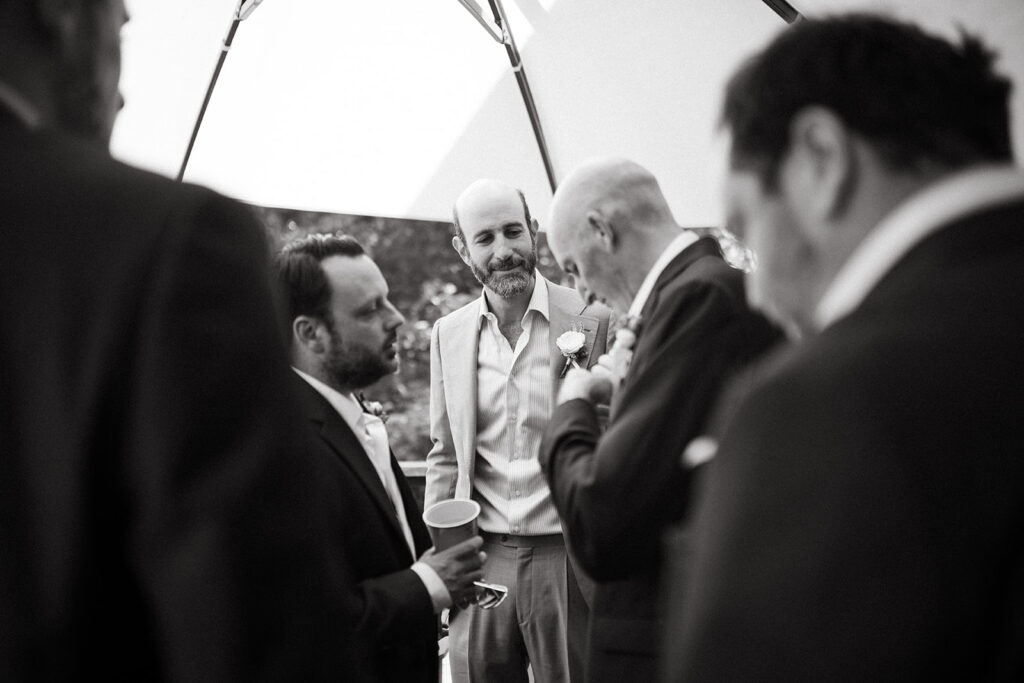 Groomsmen gathering and drinking before wedding ceremony in Abingdon, Virginia.