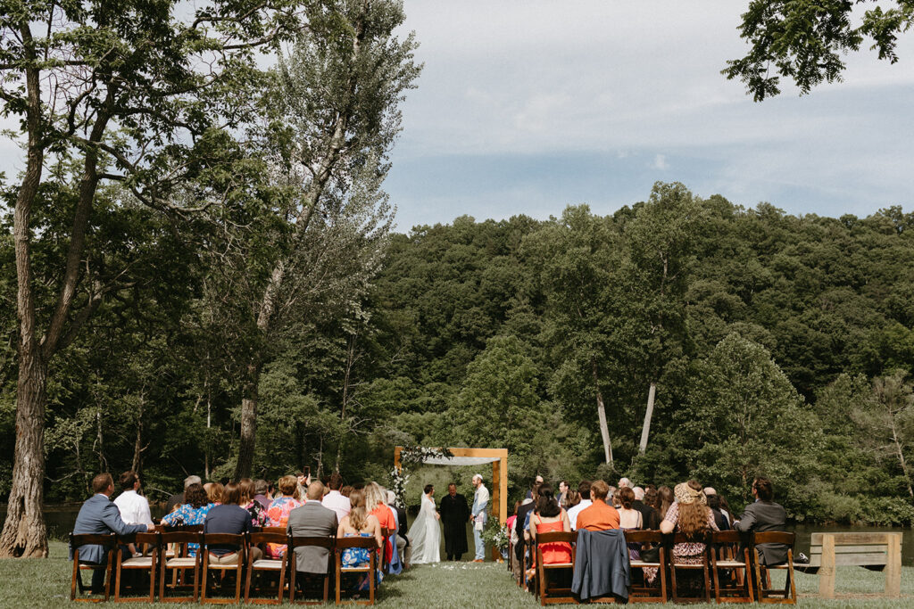 Abingdon Virginia summer wedding — Jewish wedding ceremony on the Creeper Trail, intimate moment between bride and groom surrounded by family.