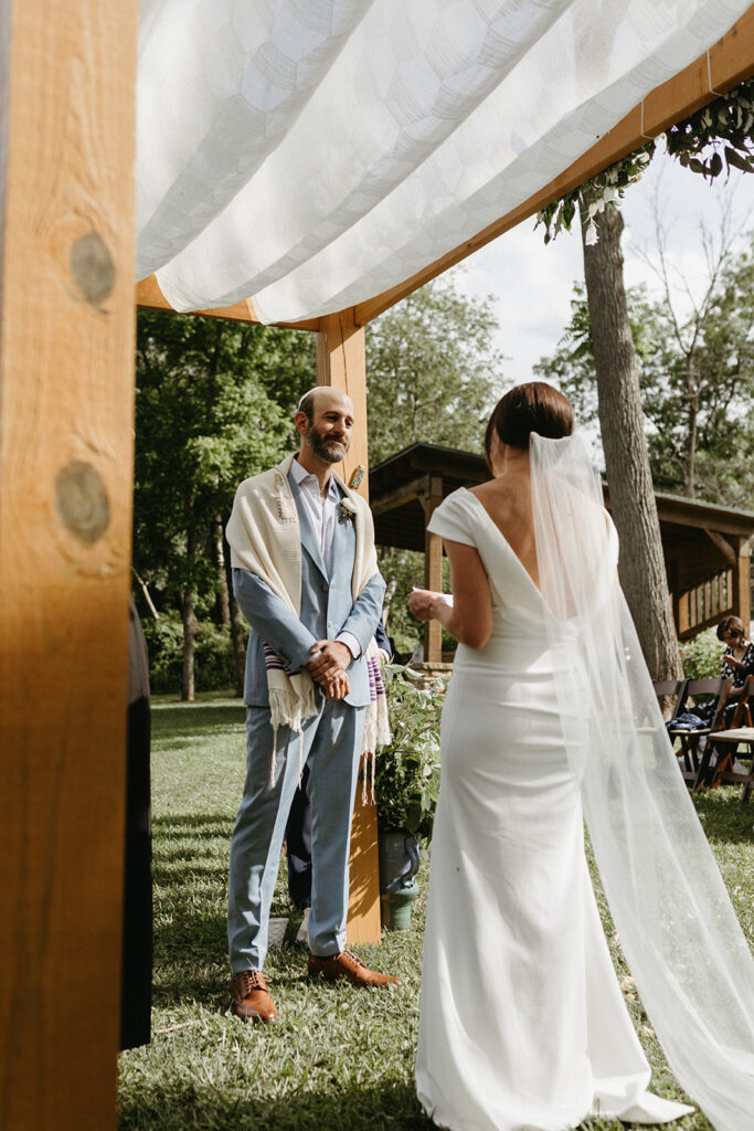 Abingdon Virginia summer wedding — Jewish wedding ceremony on the Creeper Trail, intimate moment between bride and groom surrounded by family.