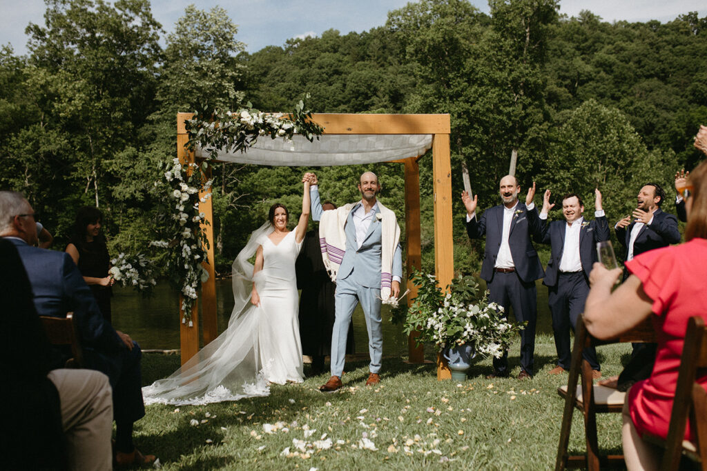 Abingdon Virginia summer wedding — Jewish wedding ceremony on the Creeper Trail, intimate moment between bride and groom surrounded by family.