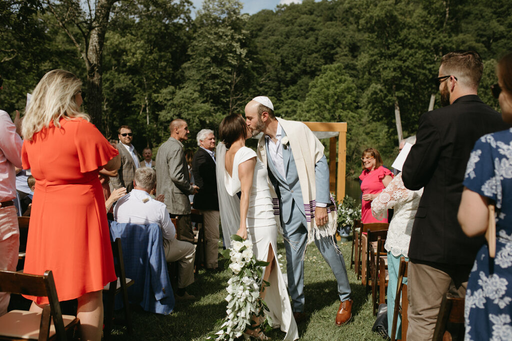 Abingdon Virginia summer wedding — Jewish wedding ceremony on the Creeper Trail, intimate moment between bride and groom surrounded by family.