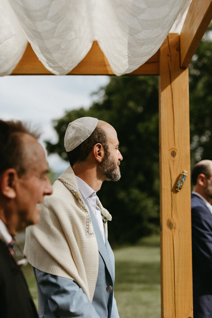 Abingdon Virginia summer wedding — Jewish wedding ceremony on the Creeper Trail, intimate moment between bride and groom surrounded by family.