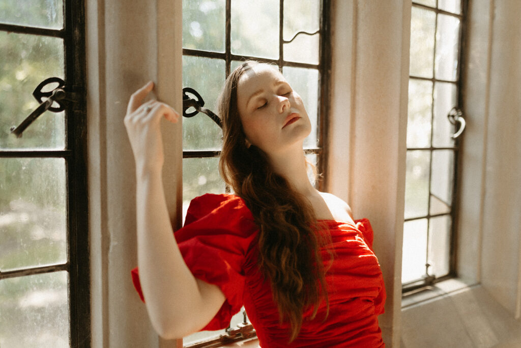 Portrait of woman in red dress at the Branch Museum in Richmond, Virginia. 