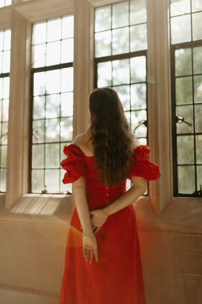 Portrait of woman in red dress at the Branch Museum in Richmond, Virginia. 
