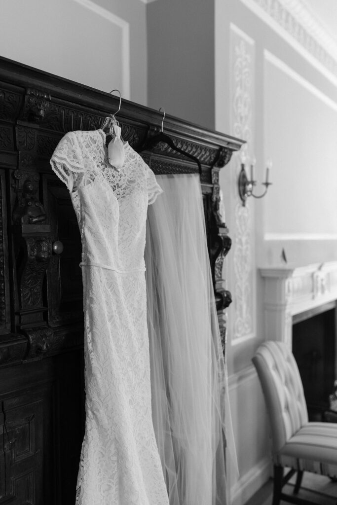 Brides gown and veil hanging in bridal suite of the branch museum.