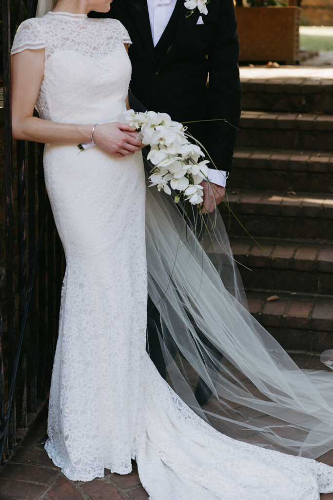 Bride and groom portrait in front of gate at Richmond venue