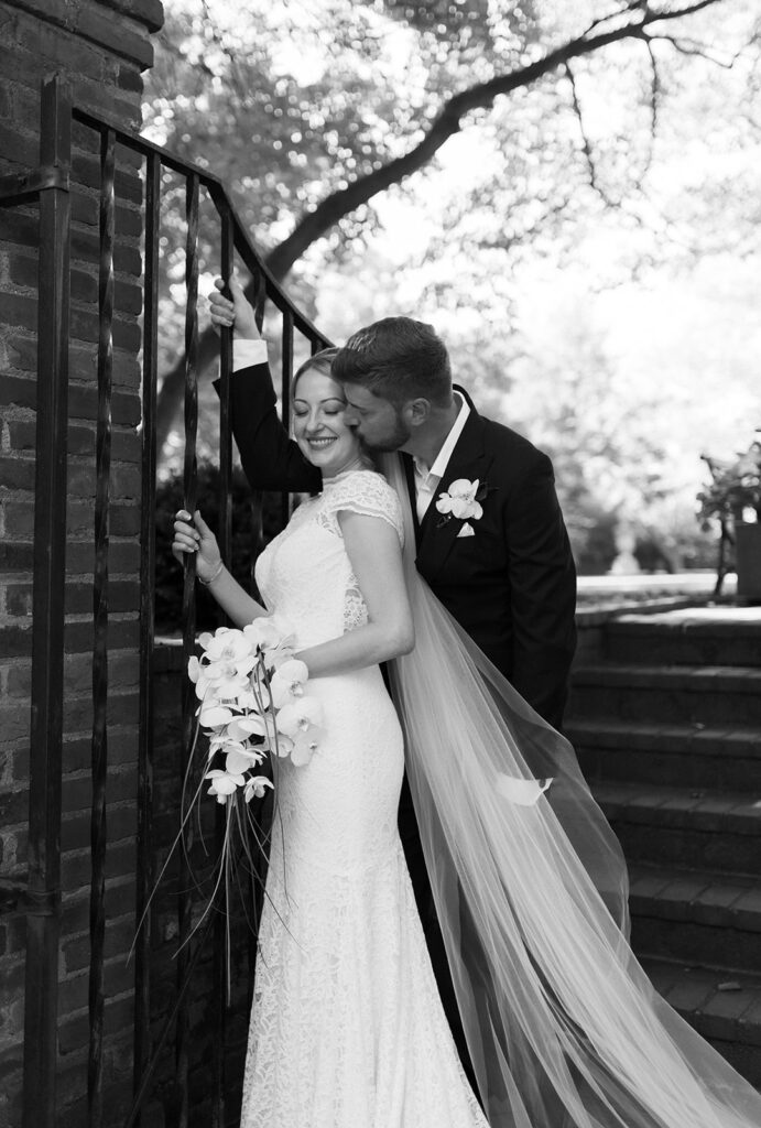 Bride and groom portrait in front of gate at Richmond venue