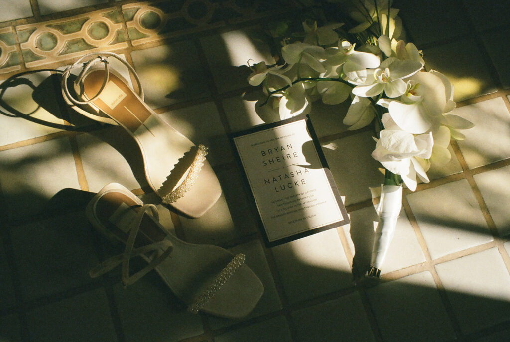 Detail shot on film of brides details on tile floor.