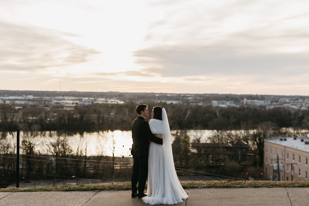 Bride and Groom looking over the city on their wedding day at Libby Hill in Richmond, Virginia.