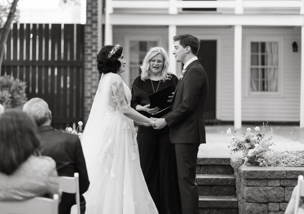 Bride and groom at their ceremony in the courtyard at the Linden Row in Richmond, Virginia.