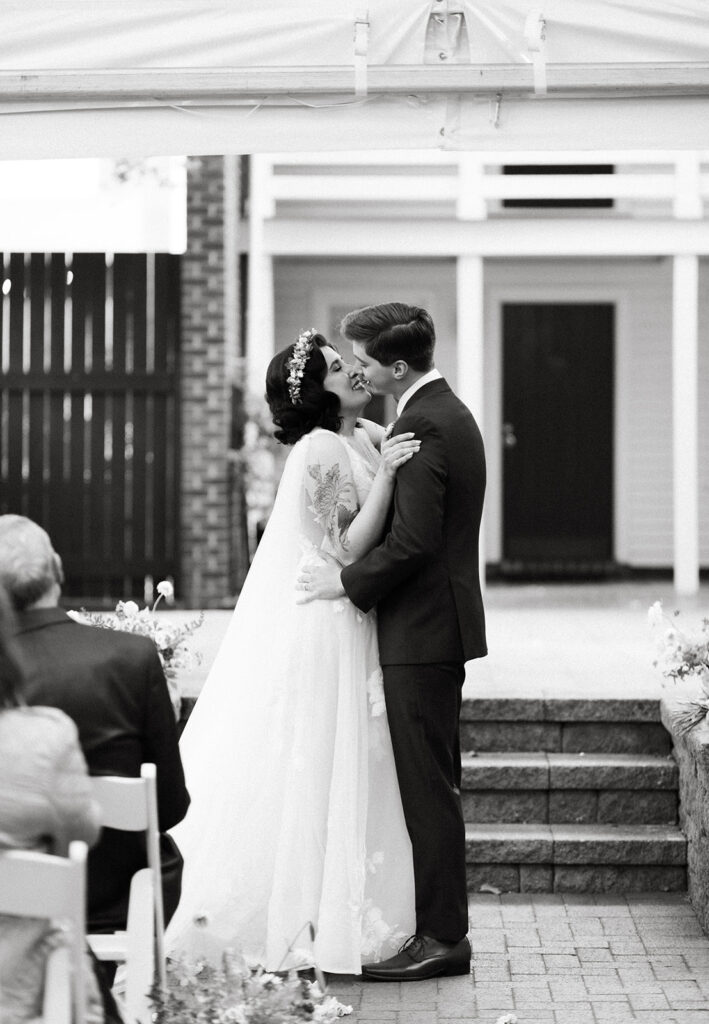 Bride and groom at their ceremony in the courtyard at the Linden Row in Richmond, Virginia.
