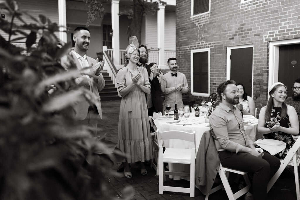 Guests clapping during speeches at the Linden Row
