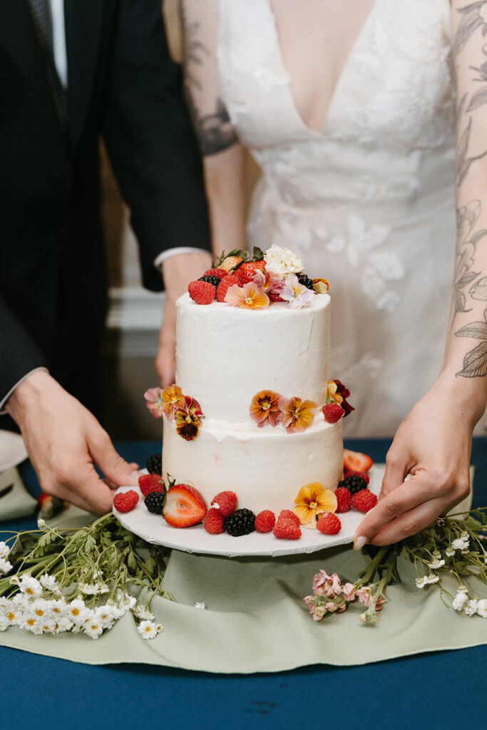 Bride and Groom cutting their cake during their wedding reception at the Linden Row.