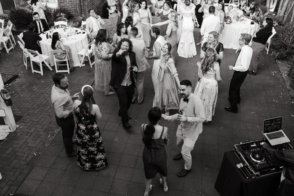 Guests dancing in courtyard at the Linden Row 