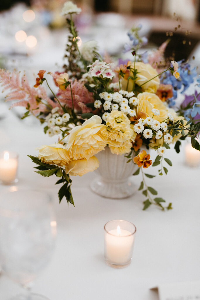 Floral arrangement on table at wedding reception at the Linden Row.
