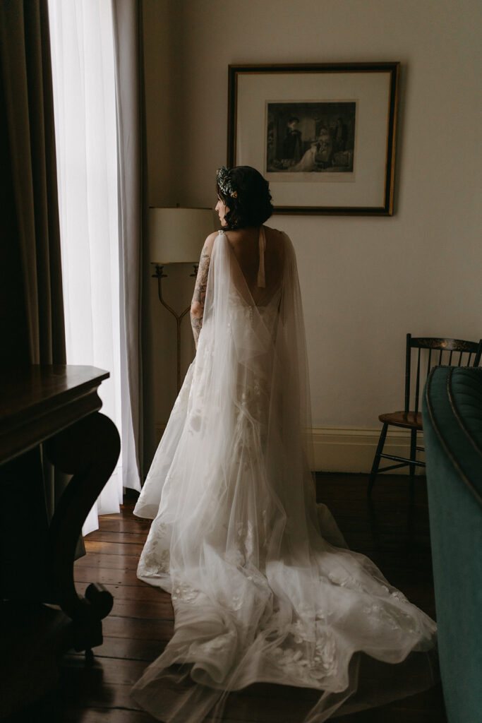 Bridal portraits in a getting ready suite at the Linden Row in Richmond, Virginia. Bride is wearing a gown from Blue Sage Bridal.