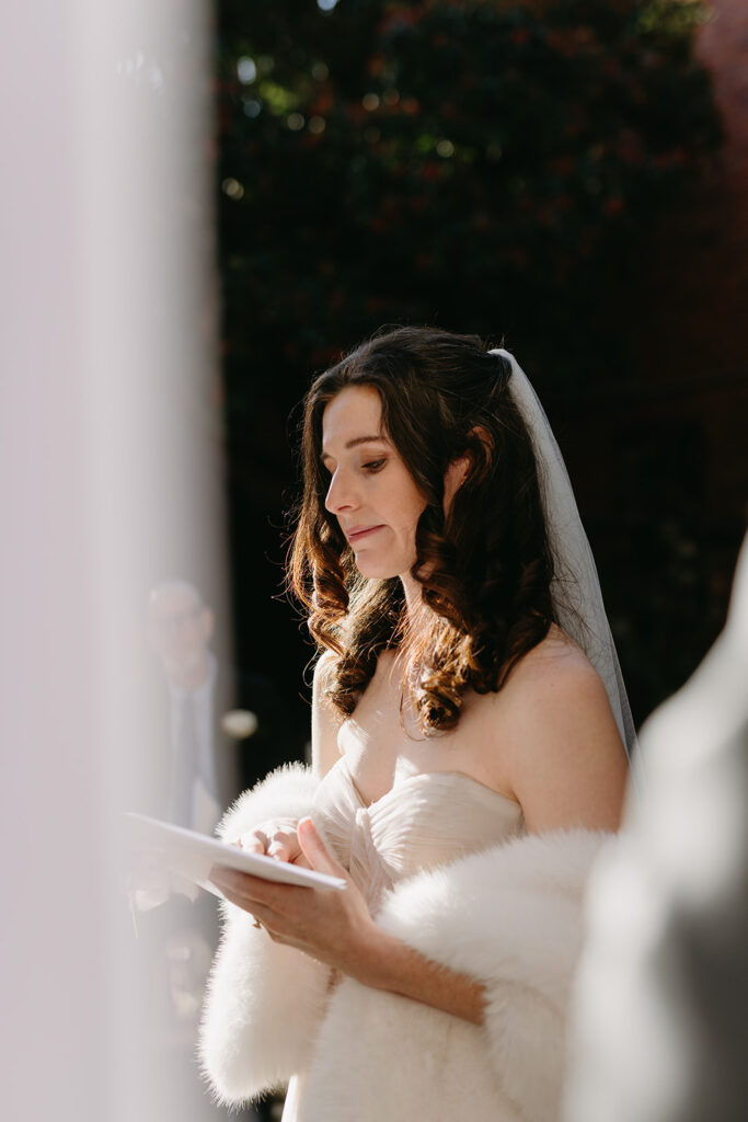Bride crying reading vows at their Richmond winter micro wedding.