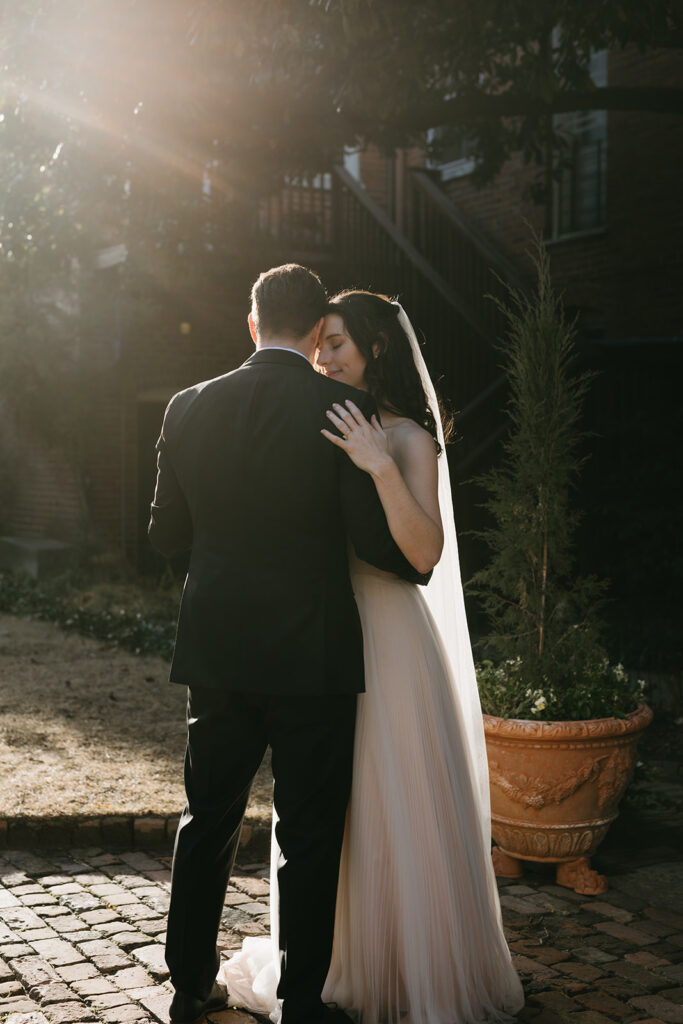 Bride and Groom having their first dance with sunset behind them at their Richmond winter micro wedding.