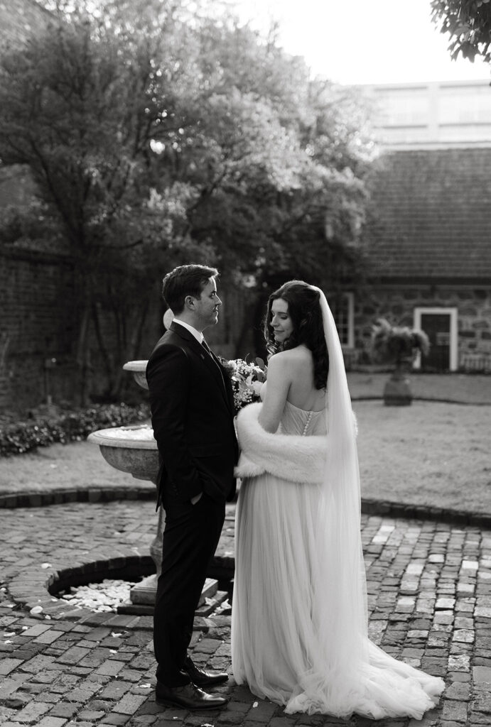 Bride and Groom portraits in the courtyard of the Poe Museum at their Richmond winter micro wedding.