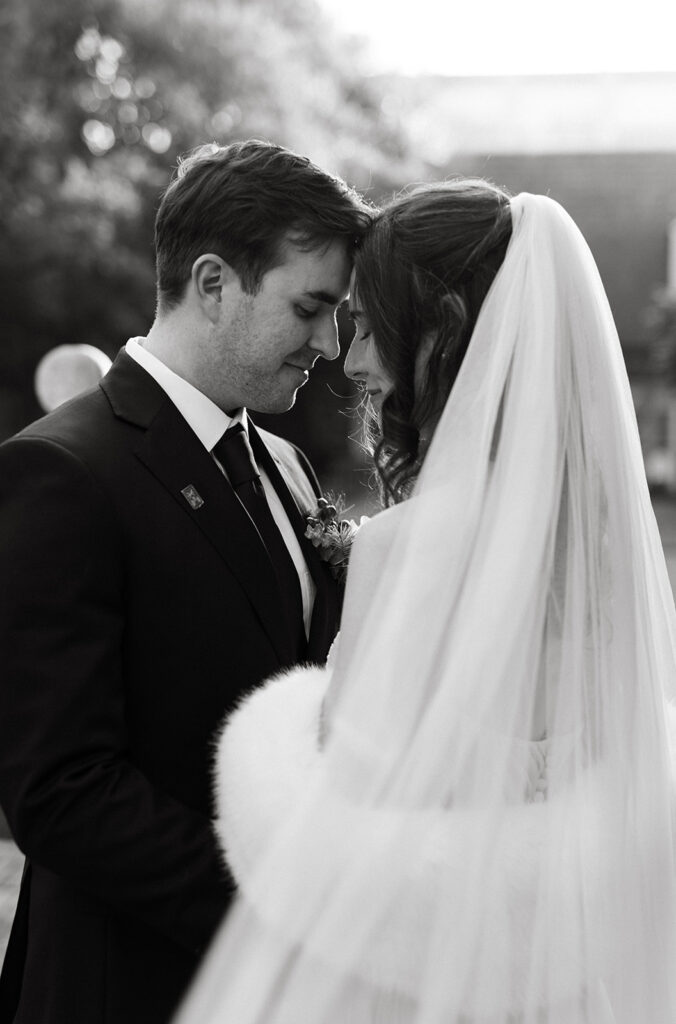 Bride and Groom portraits in the courtyard of the Poe Museum at their Richmond winter micro wedding.
