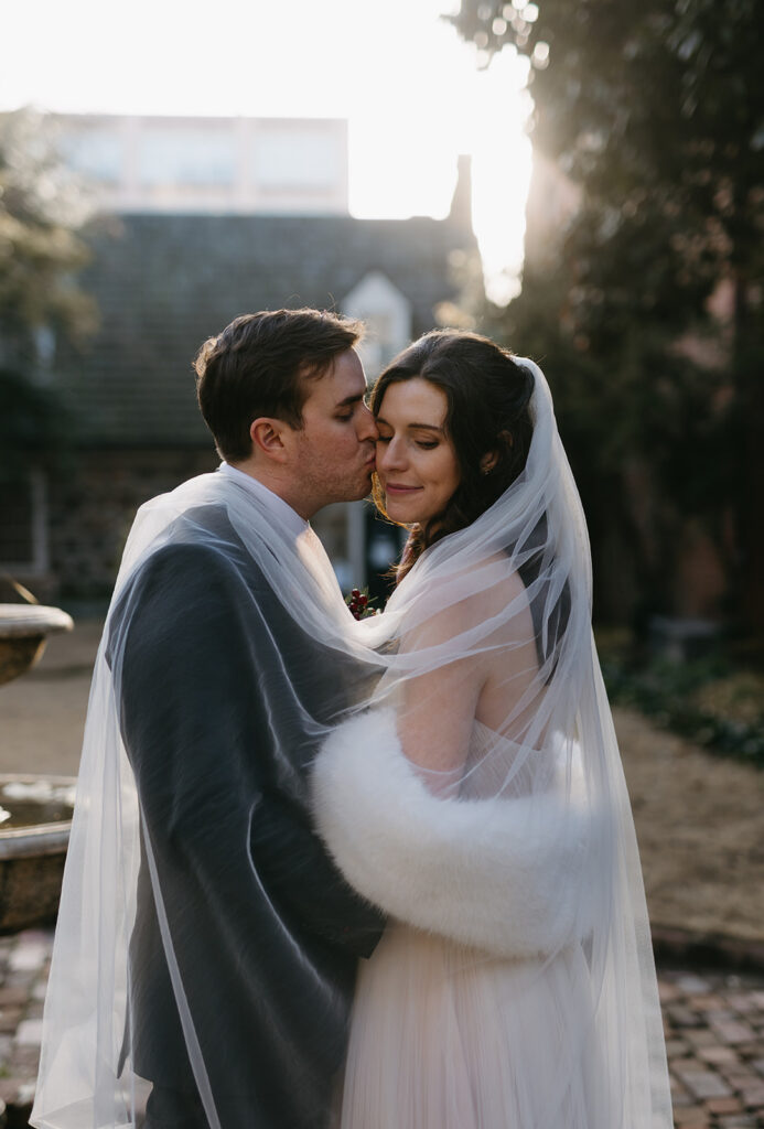 Bride and Groom portraits in the courtyard of the Poe Museum at their Richmond winter micro wedding.