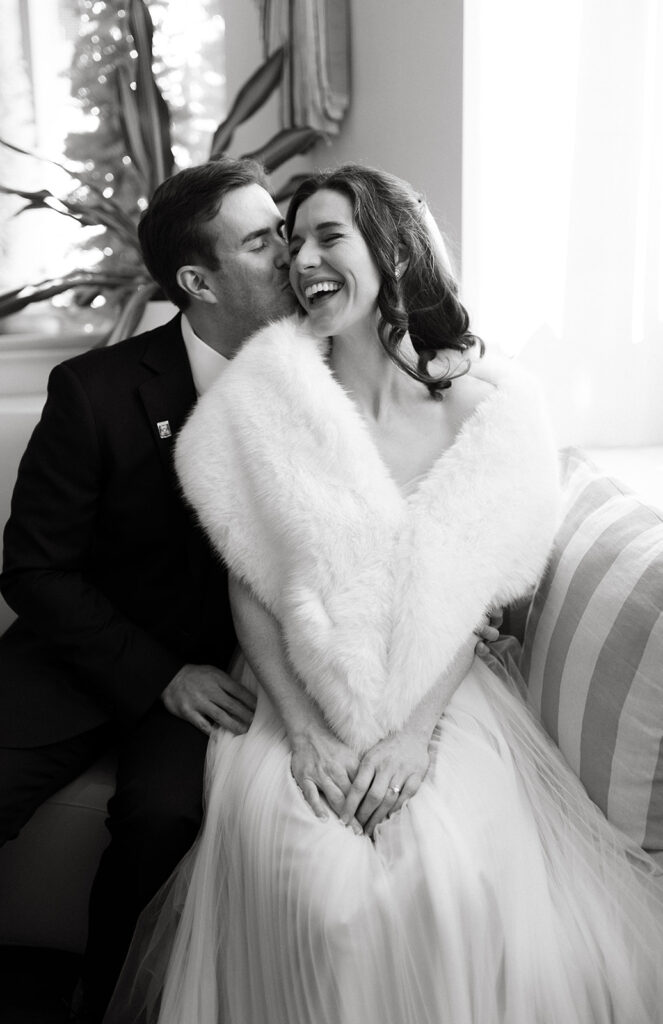 Bride and Groom portrait of them laughing together in the Quirk Hotel before their Richmond winter micro wedding.