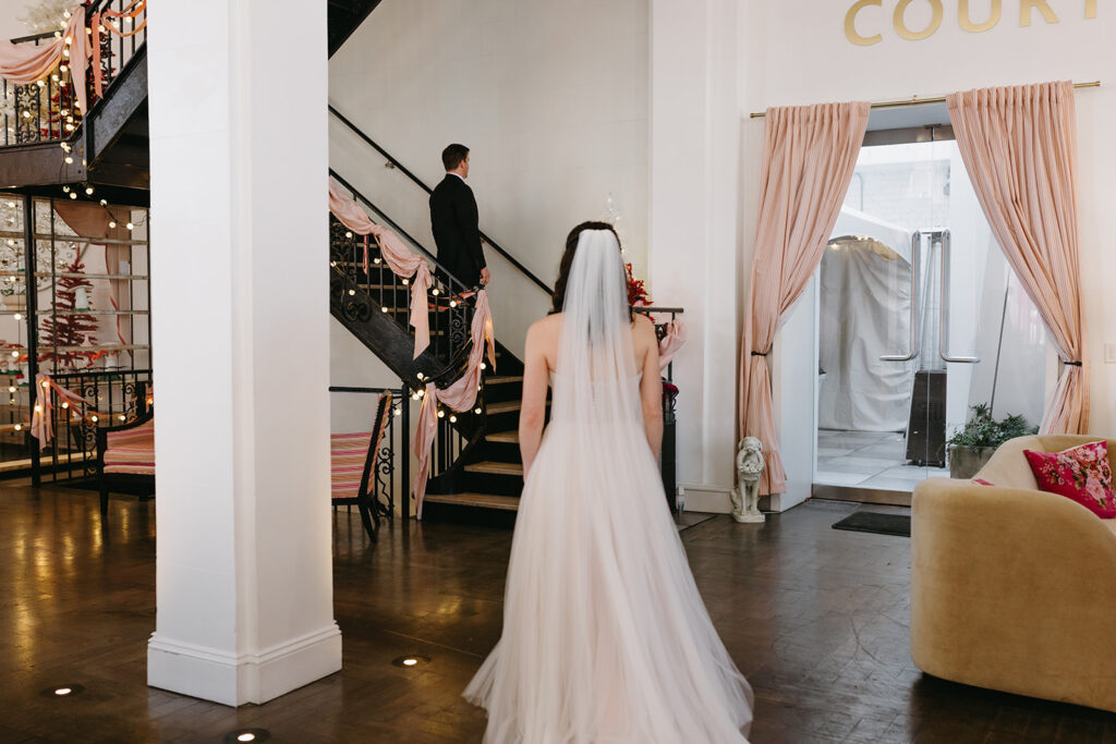 Bride and Groom at the Quirk hotel in Richmond, Virginia doing a first look before their Richmond winter micro wedding