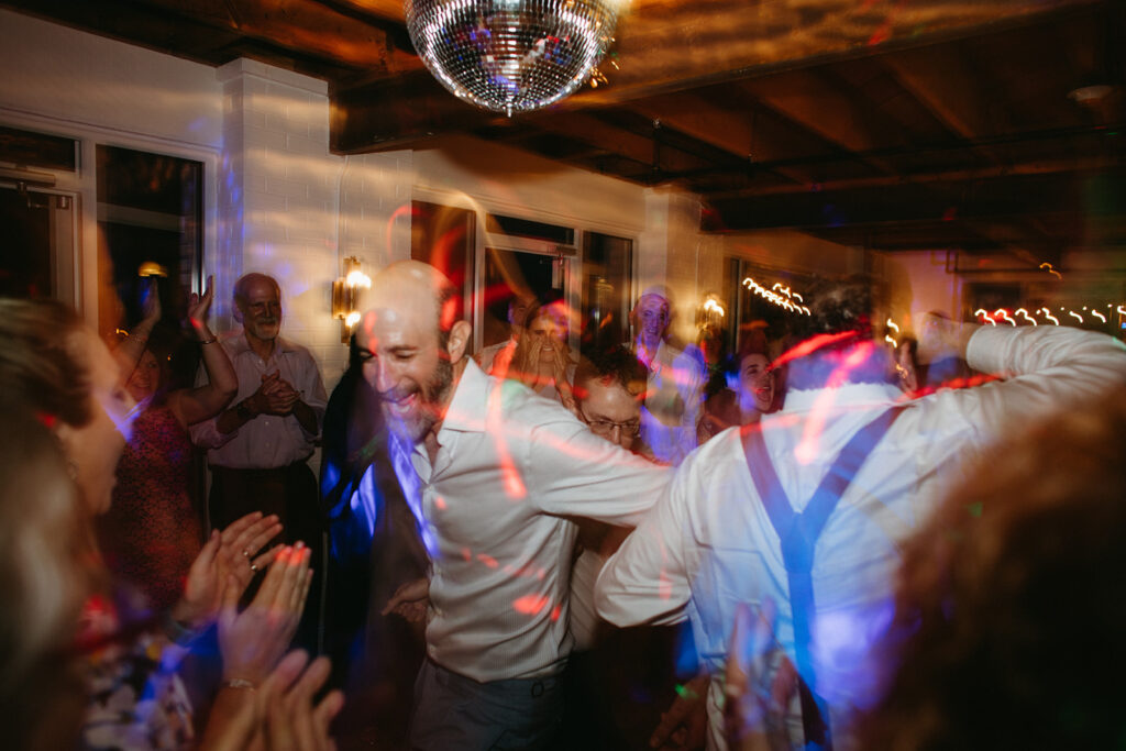 Abingdon Virginia summer wedding — lively reception with a disco dance floor at Summers Roof and Cellar, filled with laughter and dancing.