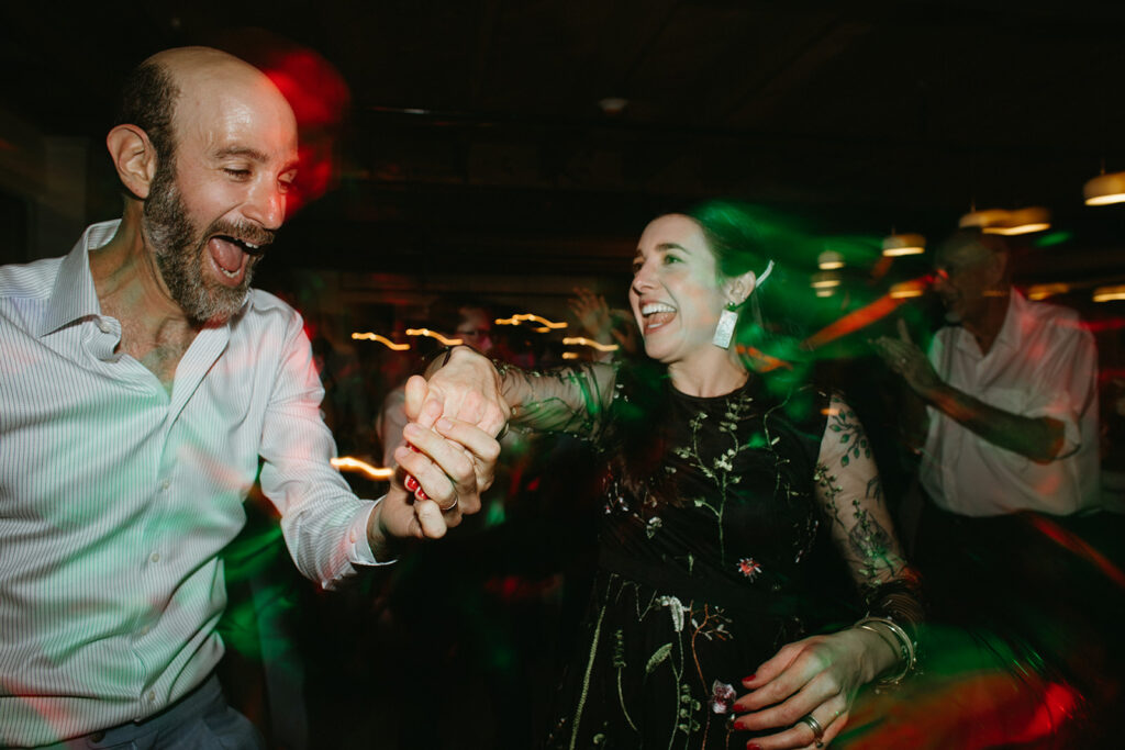 Abingdon Virginia summer wedding — lively reception with a disco dance floor at Summers Roof and Cellar, filled with laughter and dancing.