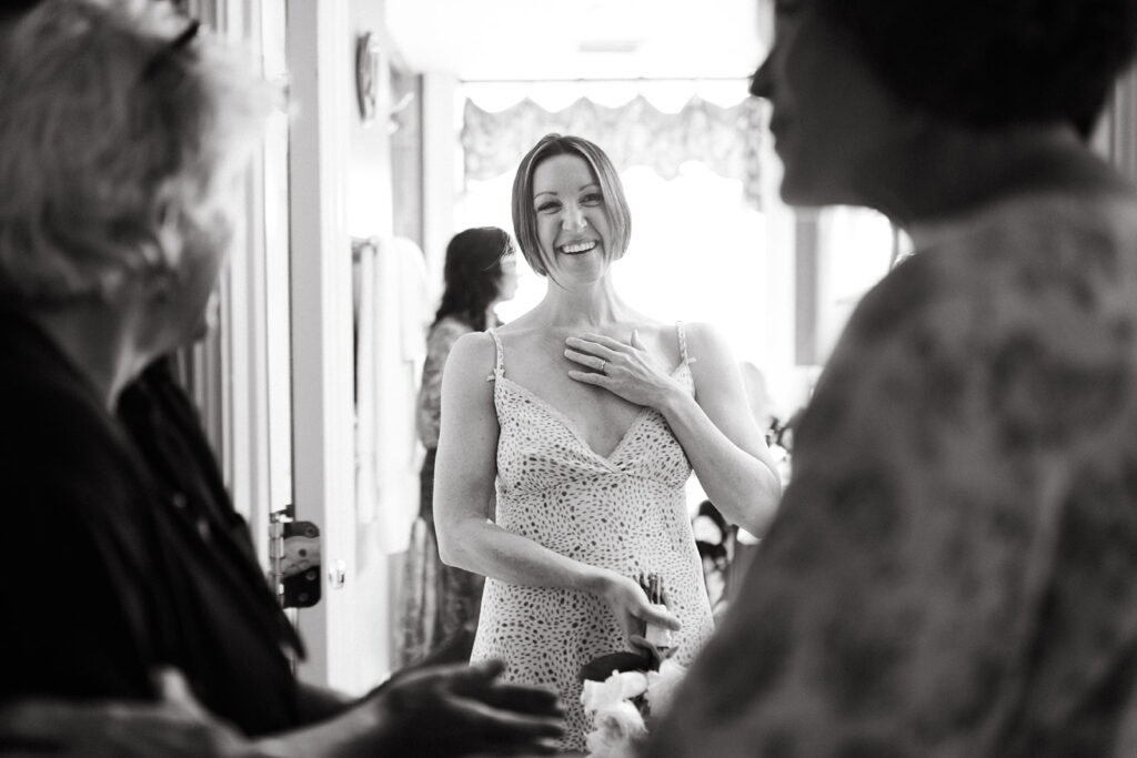 Abingdon Virginia summer wedding — bride laughing with family at Martha Washington Inn.